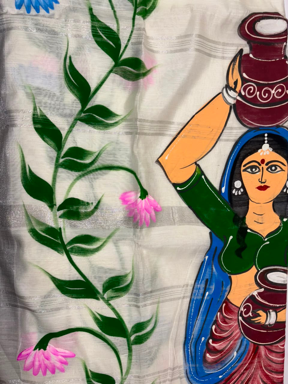A close-up of a white cotton hand-painted handloom saree